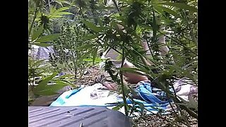 a woman is exersing in garden