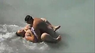 2 guys fuck a girl on the beach