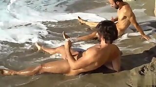 2 guys fuck a girl on the beach