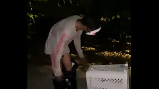 2 boys outside peeing