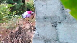 2 boys peeing outsiders
