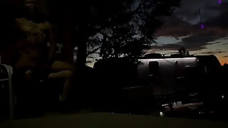 2 boys outside peeing