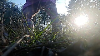 2 boys outside peeing
