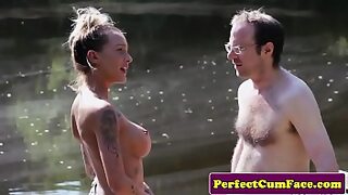 1 guy giving 2 girls blowjob
