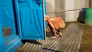 2 boys outside peeing