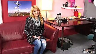 a cute woman with a hot ass is sitting down on a large dick